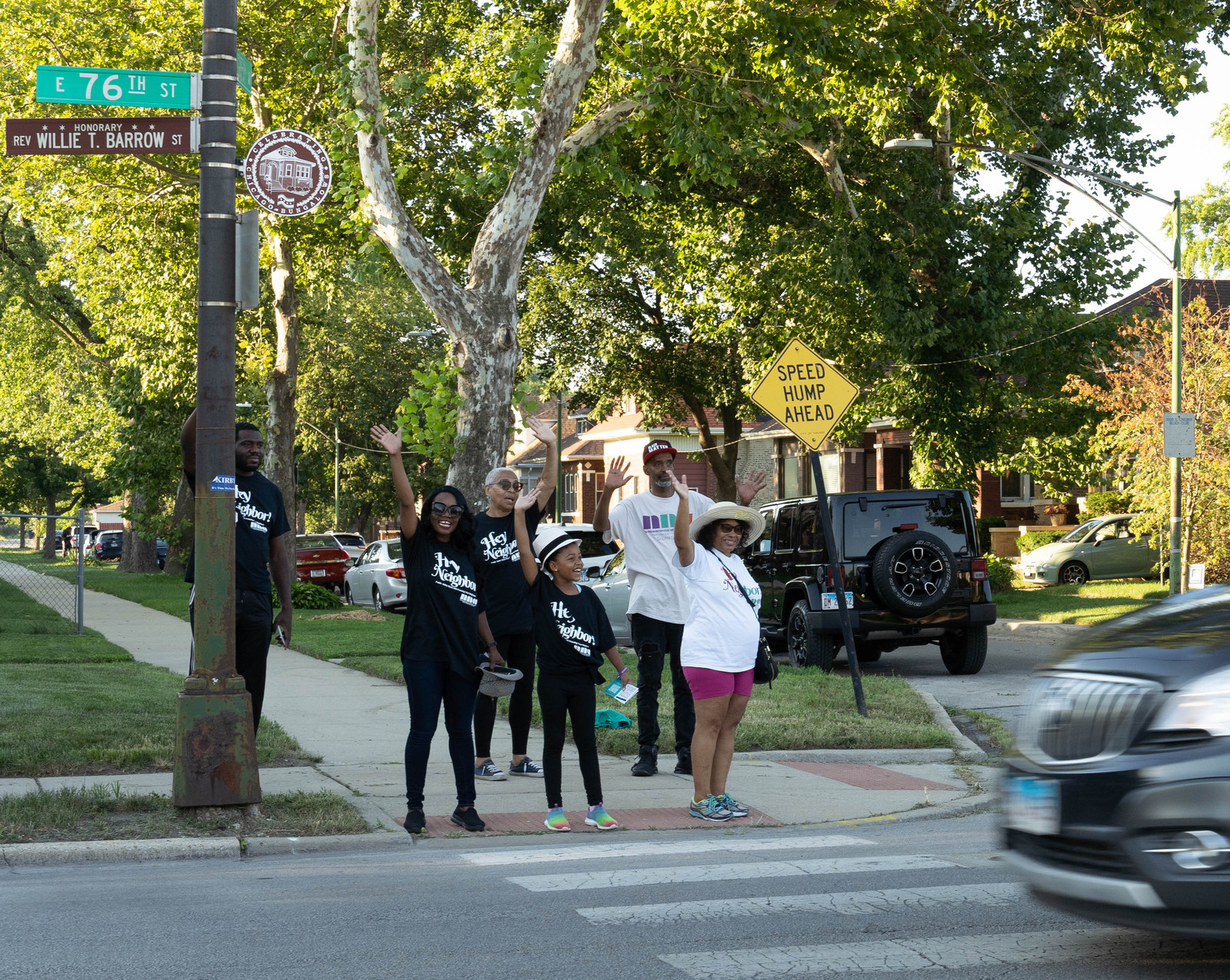 South Shore neighbors waving together at a street corner during an NNA neighborhood walk